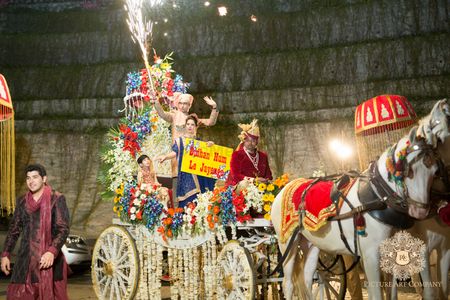 Photo of Dramatic Groom Entry on Carriage with Fireworks