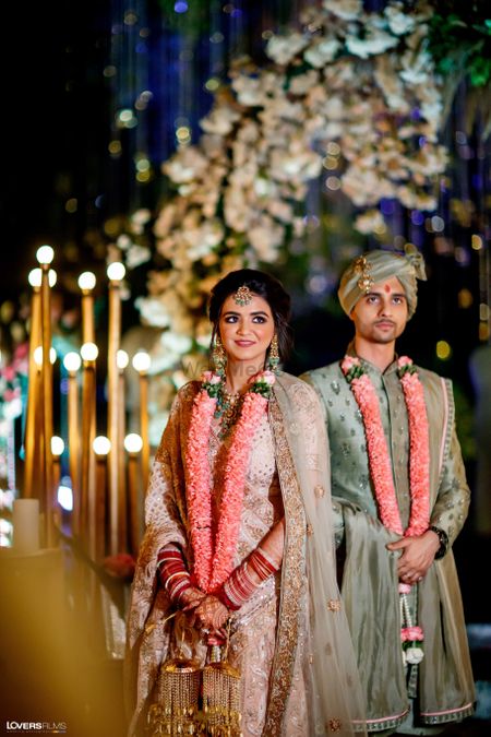 post wedding couple shot with unique jaimala
