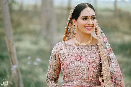 A bridal dressed in a gorgeous pink lehenga
