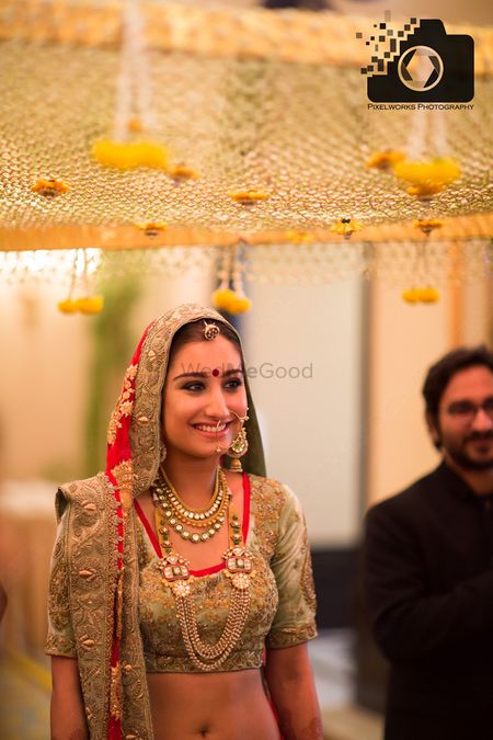 Bride in Grey and Red Lehenga Under Phoolon ki Chadar