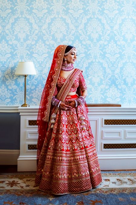 Photo of pretty red bridal lehenga with double dupatta draping style