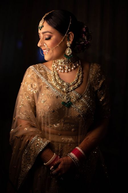 Photo of pretty gold sabyasachi lehenga in golden