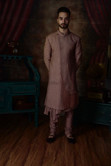 Photo of A dusty pink sherwani with matching churidars.