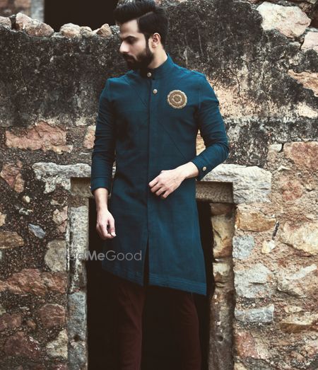 Asymmetrically hemmed bandhgala for grooms.