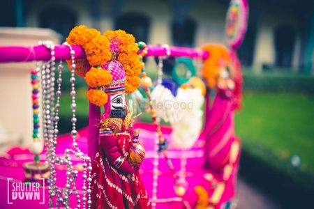 Pink Puppets with Genda Phool Arrangement for Mehendi