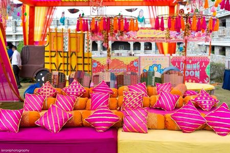 Colourful sitting arrangement for Mehendi ceremony