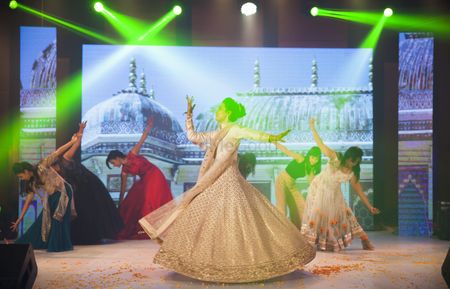 Photo of Bride Dancing on Stage During Sangeet