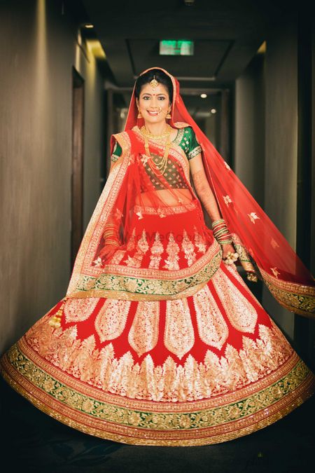 Bride in Red Lehenga with Green Border and Blouse