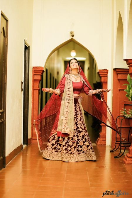 Photo of Plum Lehenga with Gold Floral Pattern and Maroon Blouse