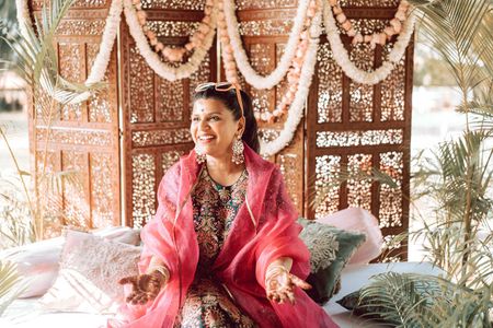 Photo of happy bride to be shot for her mehendi at home
