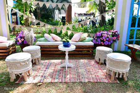 Outdoor decor with carpets, cushions, flowers, and more.