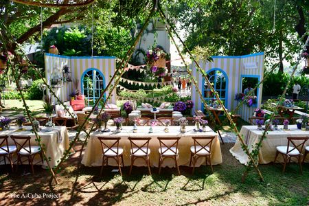 Outdoor table settings with teepee tents.