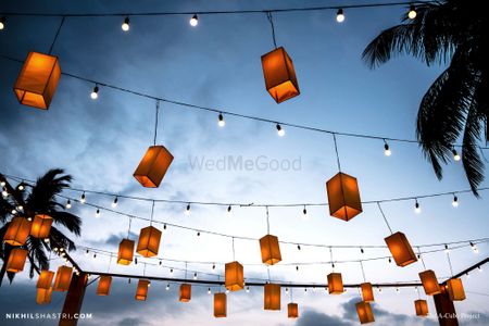 Photo of Hanging lanterns with bulbs for ceiling decor.