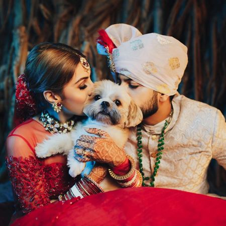 Photo of Cute couple portrait with a dog in the frame
