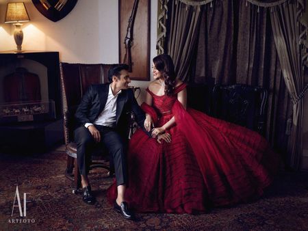 Photo of Couple on cocktail with the bride in a red gown