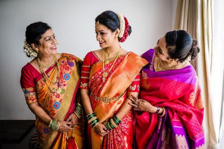 Photo of marathi bridal portrait with her mom and sister