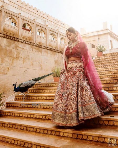 Photo of Bride walking down the staircase.