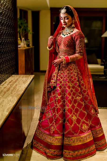 red modern bridal lehenga with gold work