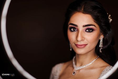 bridal makeup for cocktail with bold brows and smokey eye