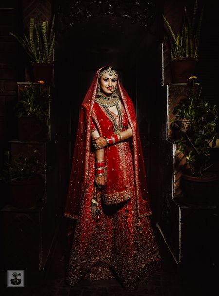 Photo of bright red bridal lehenga with sequin work