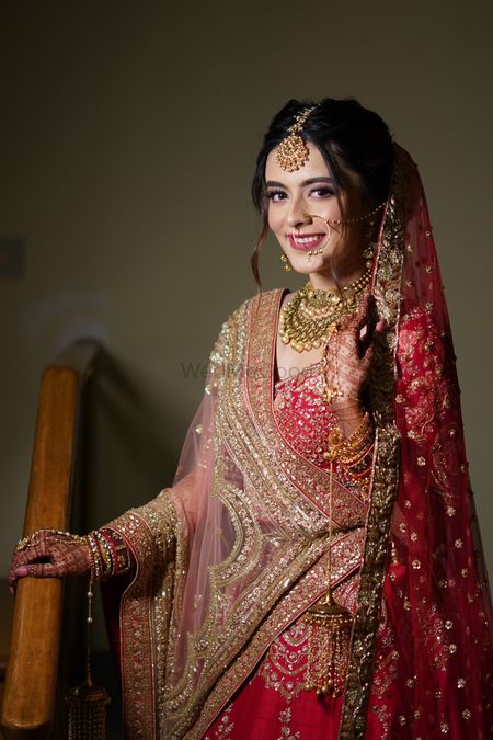Photo of Bride wearing a red lehenga on the wedding day.