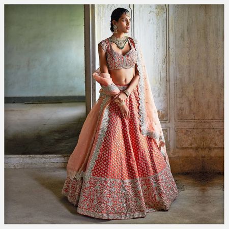 A coral lehenga with intricate details.