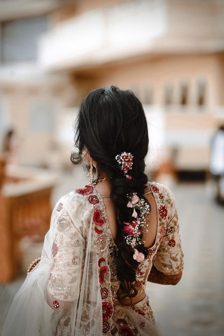 Messy floral braid hairstyle.