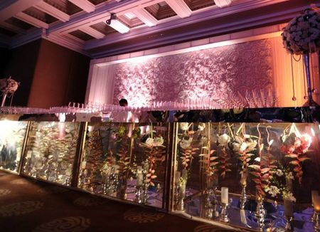 Photo of bar decor with see through glass and florals inside the glass