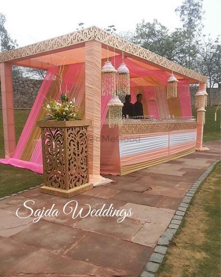 Photo of pastel peach pink and white bar decor