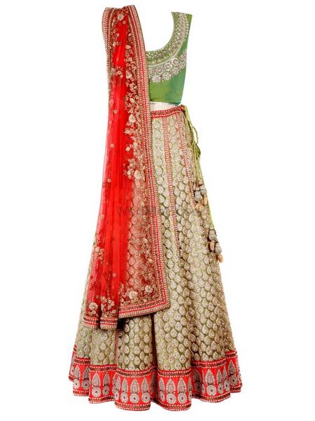 green apply colored blouse with gold lehenga skirt and red dupatta
