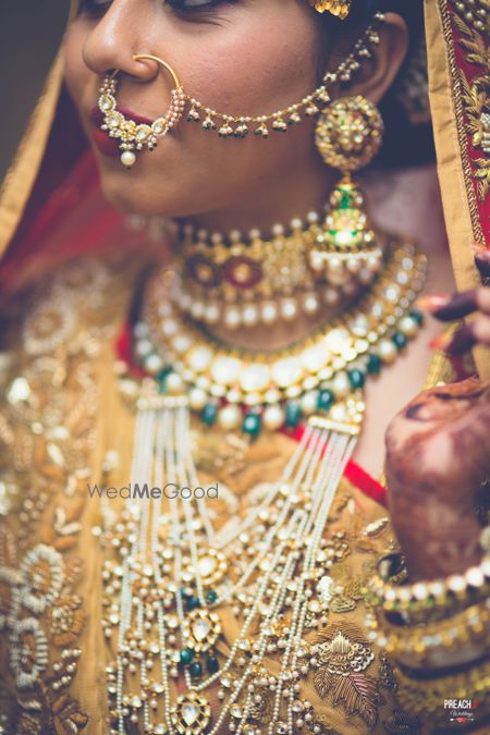 Photo of Bride wearing layered indian jewellery