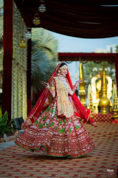 Photo of Red Lehenga with Green Thread Work and Yellow Dupatta