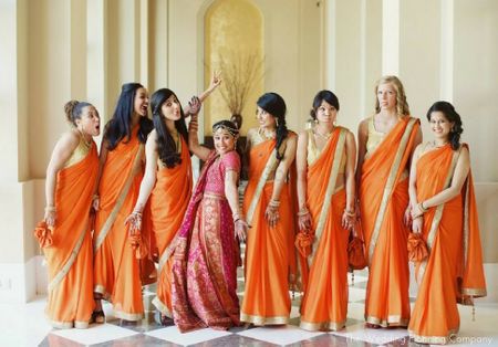 Matching Bridesmaids in Orange Sarees Fun Photo