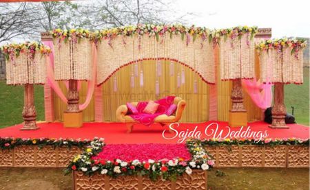 stage backdrop in pink and peach and gold