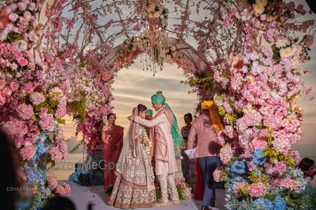 Photo of unique jaimala stage with over the top florals