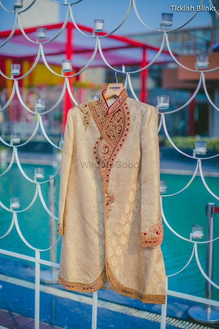 Photo of Beige Sherwani with Red Embroidery