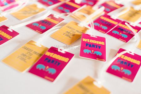 Photo of Wedding Party Tags with Motifs for Destination Wedding