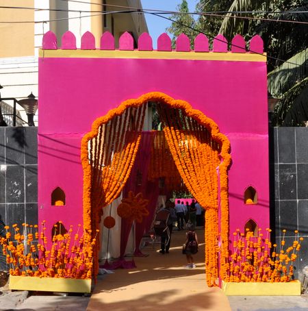 Photo of magenta hot pink and orange rajasthani bhaat ceremony decor