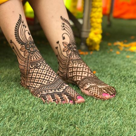 An intricate and beautiful feet mehendi design