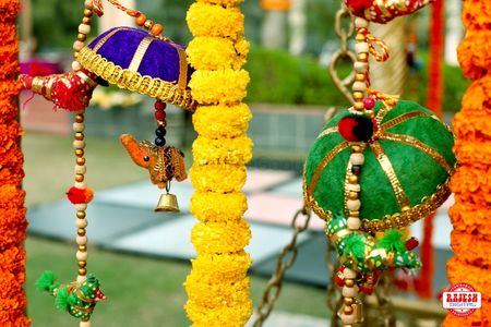 Photo of Hanging floral string and small umbrellas mehendi decor
