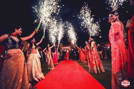 Guests Holding Light Pyro for Bride and Groom Entrance