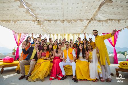 Photo of Bride and Groom with Friends in Yellow Theme