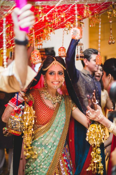 Happy Bride Under Phoolon Ki Chadar