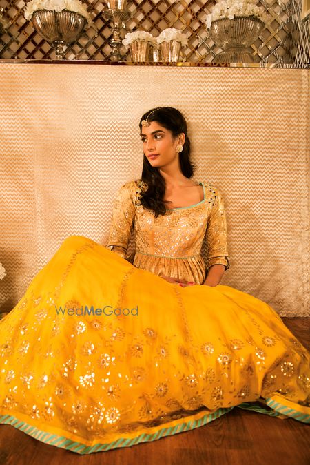 Photo of Yellow and Aqua Peplum Lehenga with Gold Motifs