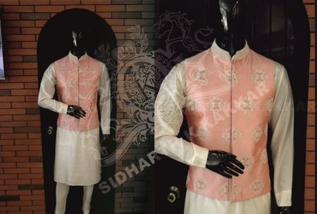 peach waistcoat with embellishment worn over white kurta
