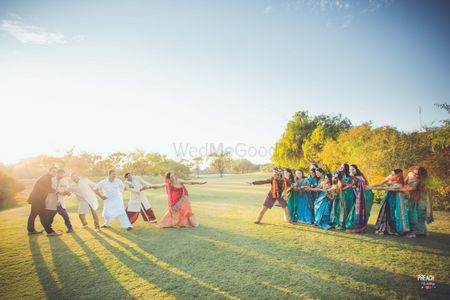 Photo of Guests Playing Tug of War at Wedding