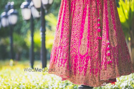 Photo of Pink Bridal Lehenga with Minaret Design and Tassels