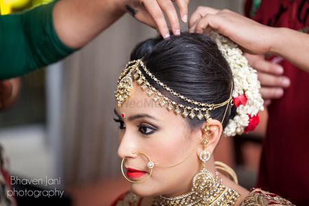 Bride Getting Ready with 2 Strand Mathapatti