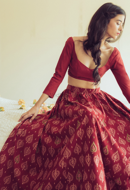 Photo of red batik printed cotton lehenga with full sleeves and scoop deep necklines