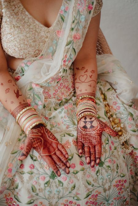 Photo of Bridal mehendi with quirky elements.